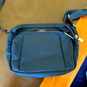 Tumi blue nylon crossbody. Voyageur collection. Travel friendly. New condition